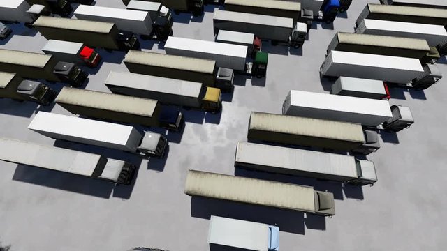 Aerial Top View of Semi Truck with Cargo Trailer Parking with Other Trucks on Special Parking Lot.