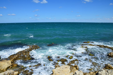 Fototapeta na wymiar Stony seashore. The waves beat on the shore. Black Sea, Sevastopol, Crimea.