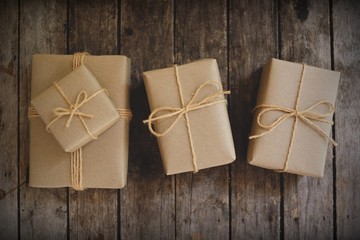 Eco friendly gift boxes wrapped with brown paper, green happy new year present concept