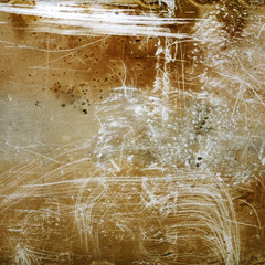 Brown grunge textured background with scratches and grain.