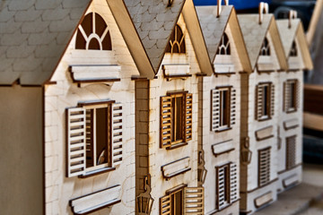 Laser cut plywood dollhouse in workshop. Plywood toys production. Close-up