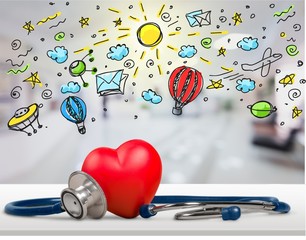 Obraz premium Red heart and a stethoscope on backgrouund