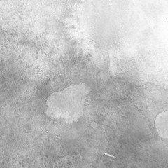 Fototapeta premium Winter gray watercolor texture with abstract washes and brush strokes on the white paper background.