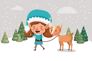 Obraz na płótnie Canvas cute girl santa helper with reindeer in snowscape