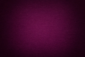 Texture of old purple paper background, closeup. Structure of dense cardboard.