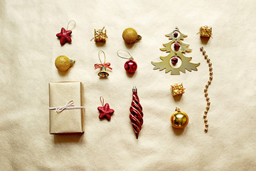 Flat lay of christmas toys on golden