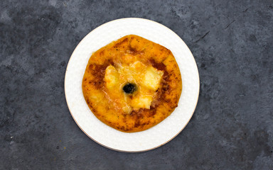 homemade arabic margarita mini pizza with  tomatoes, cheese, black olive, Thyme  on gray wooden background