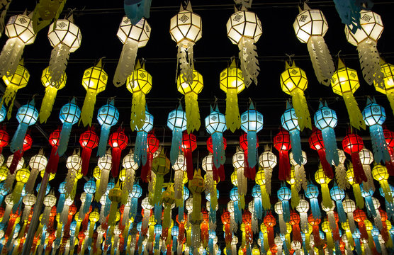 colorful hanging lanterns lighting on night sky in loy krathong festival at northern of thailand