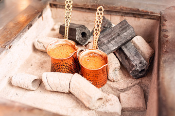 Cooking oriental coffee in a copper jezve pot in Istanbul, Turkey
