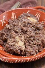 chicken with rice on ceramic dish