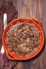 chicken with rice on ceramic dish