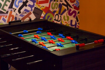 Table soccer in game room.