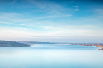 Fototapeta premium blue sky and clouds, blue lake stil water, panoramic view from high