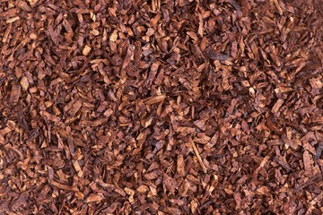 A closeup and detaild view of tobacco leave that have been crimp cut and ready for smoking.