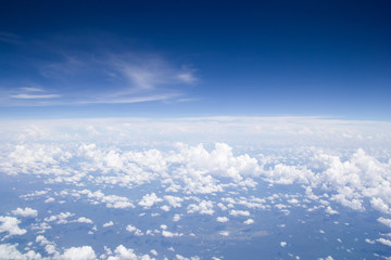 Naklejka na ściany i meble Blue sky cloud background.aerial view abstract beautiful sky over the ocean from airplane window