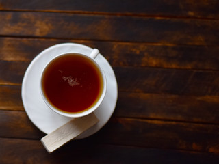 tea in a white Cup on a dark background
