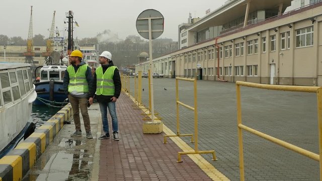 brigadier and contractor discuss work