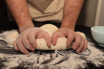 Kneading bread dough by hands