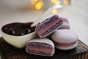 macaroons with currants on a white plate with jam