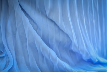 Abstract background of soft and smooth woman’s satin dress.