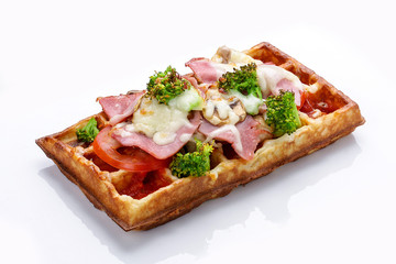 Belgian waffle on a white background. Stuffed with ham cheese and broccoli