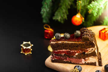 Fototapeta na wymiar Festive Christmas chocolate cake with buleberry fresh fruit.