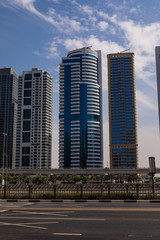 Dubai, UAE - October, 2018. Futuristic city landscape with roads, cars and skyscrapers.