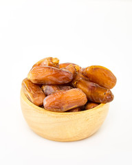 Bowl of dried dates on white