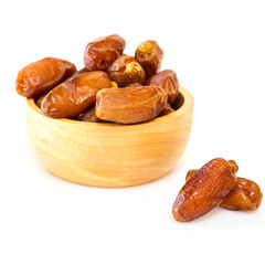 Bowl of dried dates on white