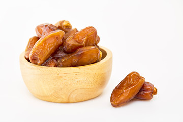 Bowl of dried dates on white