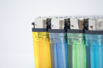Multicolored gas lighter in package for sale. (selective focus)