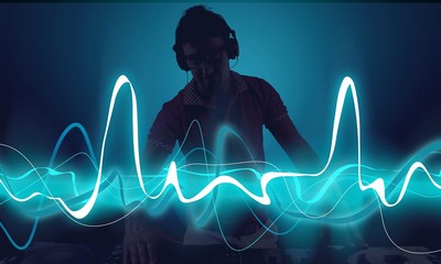 Portrait of confident young DJ with headphones