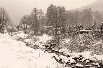 Winter landscape of the village covered with snow in vintage style