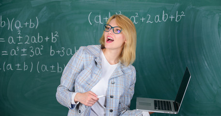 Educator smart clever lady with modern laptop searching information chalkboard background. Learn it...