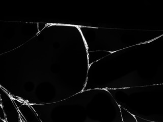 Cracked glass texture on black background. Isolated realistic cracked glass effect.
