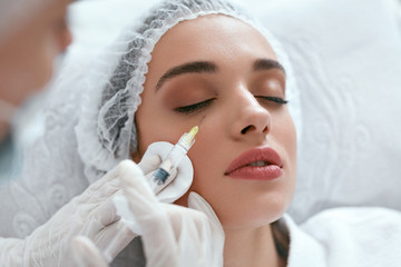 Cosmetology Procedure. Woman Receiving Face Skin Lift Injections