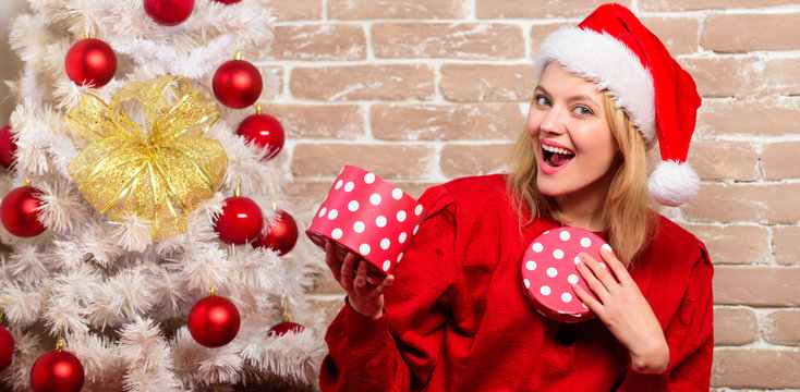 Merry christmas and happy new year. happy girl in santa claus hat. delivery christmas gifts. New year party. Smiling woman celebrating christmas. Merry Christmas and Happy Holidays. Real feelings