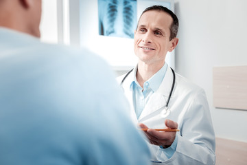 Positive delighted doctor asking questions