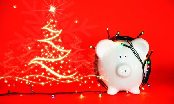 White Ceramic Piggy Bank In The Garland On A Red Background