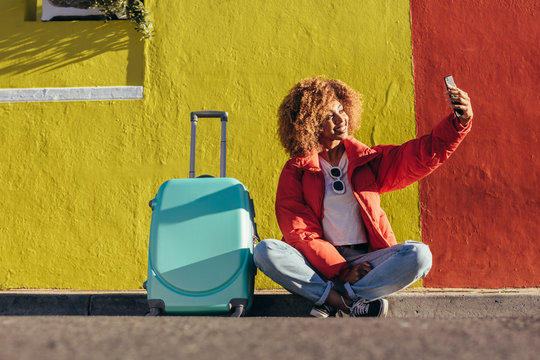 Female traveller taking a selfie outdoors