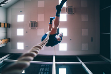 Fireman climbs up a rope at the station.