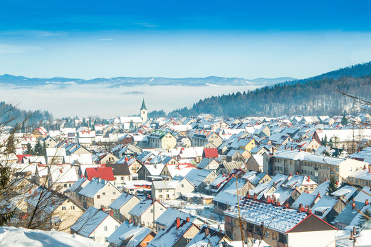    Croatia, Gorski kotar, town of Delnice in winter, panoramic view, houses under snow 