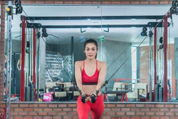 Beautiful asian woman play fitness in the gym,Thailand girl has a slim body,Time for exercise,People love heath,Stretching body before workout,Sport woman warm up body