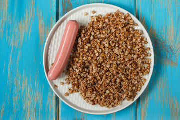 buckwheat, Bowl of tasty porridge on wooden table, top view. copy space