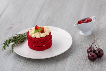 Thai Cake. Velvet red cake. Cookies decorated with red cake on wooden table and flower. strawberries morning. Sweet and sherry. Cherry in the cup. Sweet and Cherry.