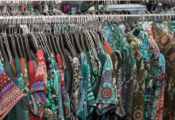 stall with vintage clothes hanging
