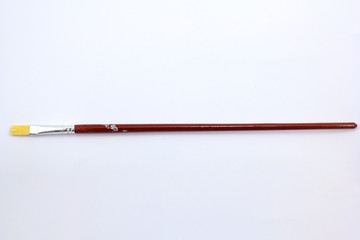 Paint brush isolated on white with wooden handle