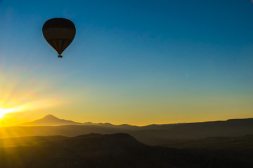 Fototapeta na wymiar Cappadocia hot air balloon sunrise silhouette 