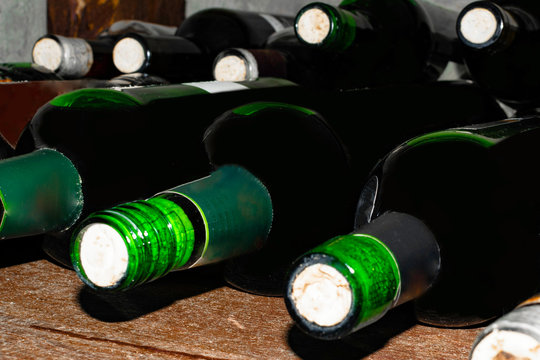Wine vault. Nice composition of wine glass on a wooden table.