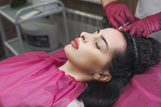 Close up still of collagen injection. Cosmetological prosedure of botox injection. Woman in the beauty salon makin anti-agieing procedures.
